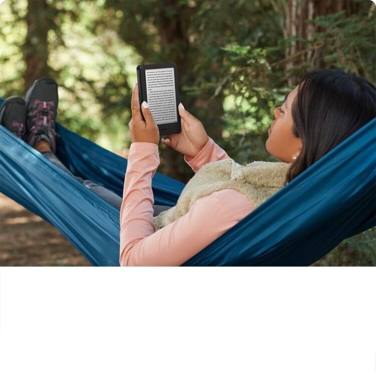 a woman reading a book using kindle